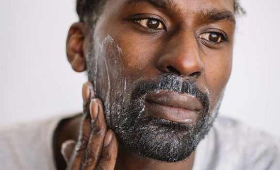 black man washing beard
