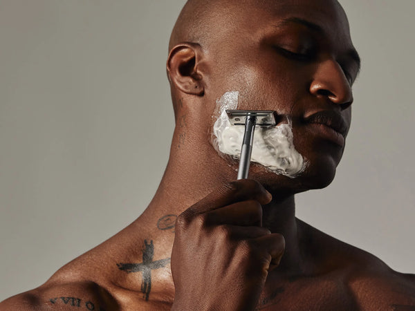 black man shaving with aaron wallace 