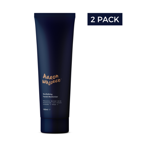 Navy blue tube of Aaron Wallace daily facial moisturiser with '2 Pack' label on a white background