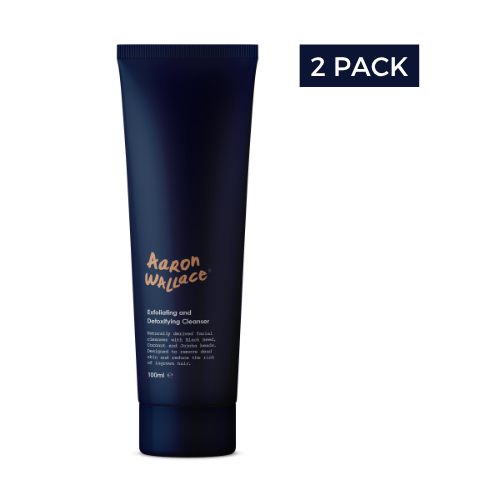 Dark blue tube of 'Aaron Wallace' cleanser with '2 Pack' label on a white background